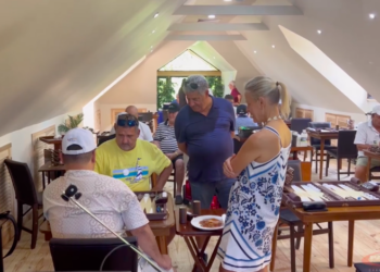 Mark Mahfood in a tense game with Paul Linderman, while Gassan Azan and Cristina Constantini look on